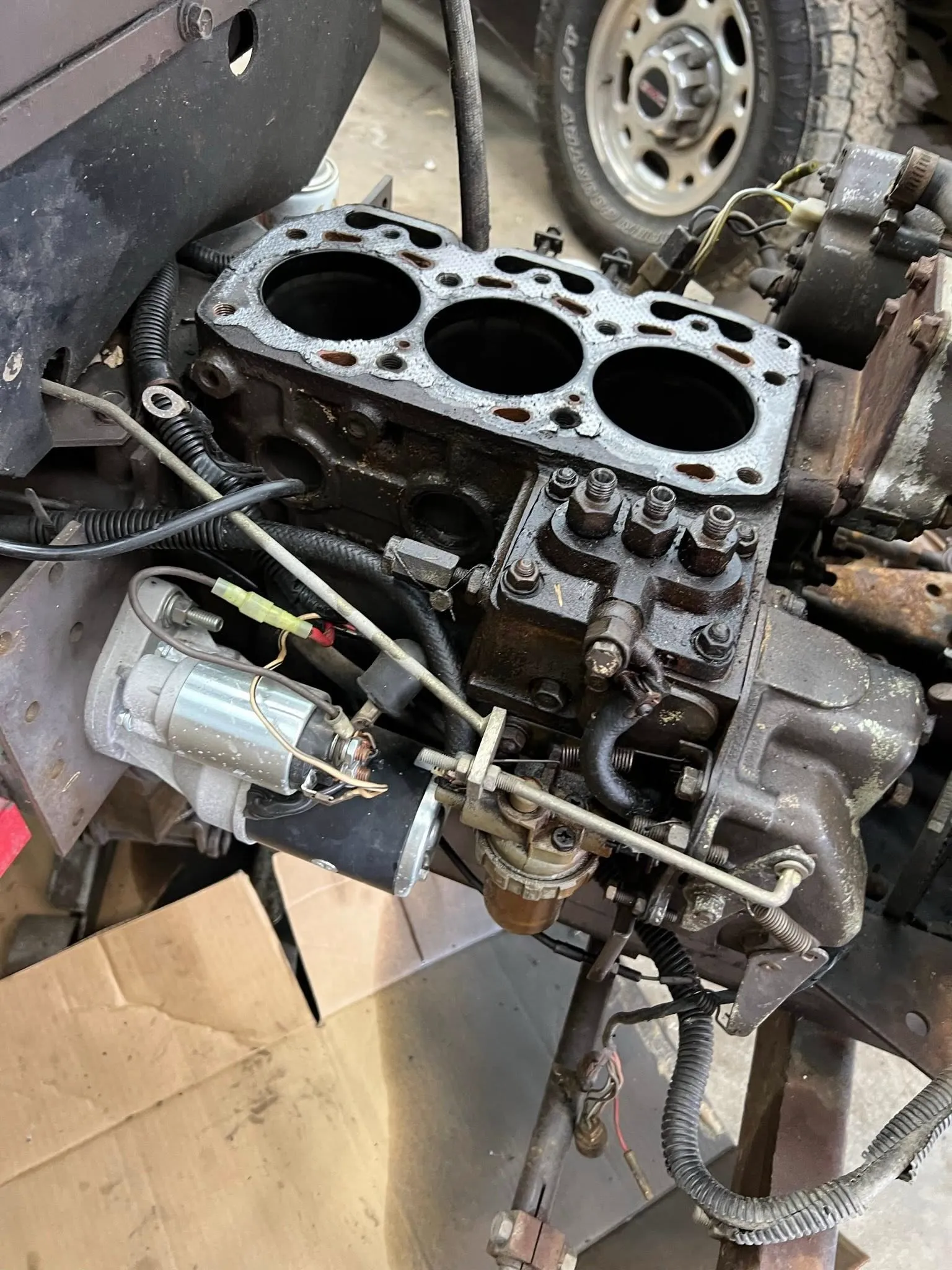 Diesel block with the head off — cylinders and injection pump exposed