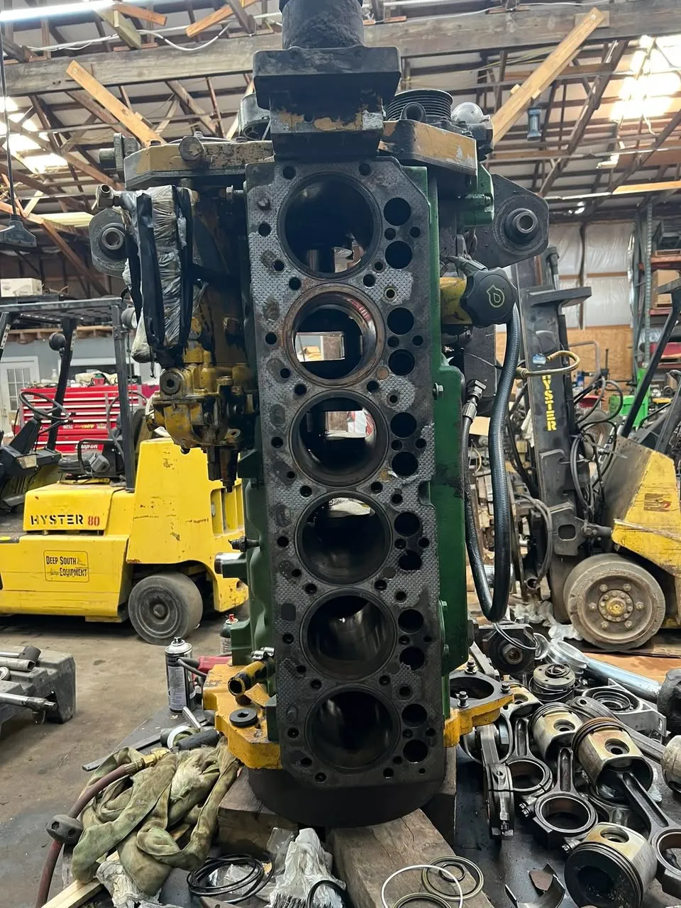 John Deere engine block lifted out for machine work