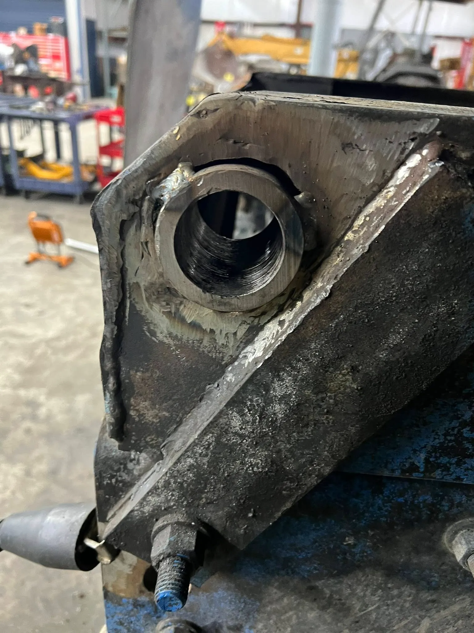 Rebuilt and re-bored pivot bracket, welded back to spec